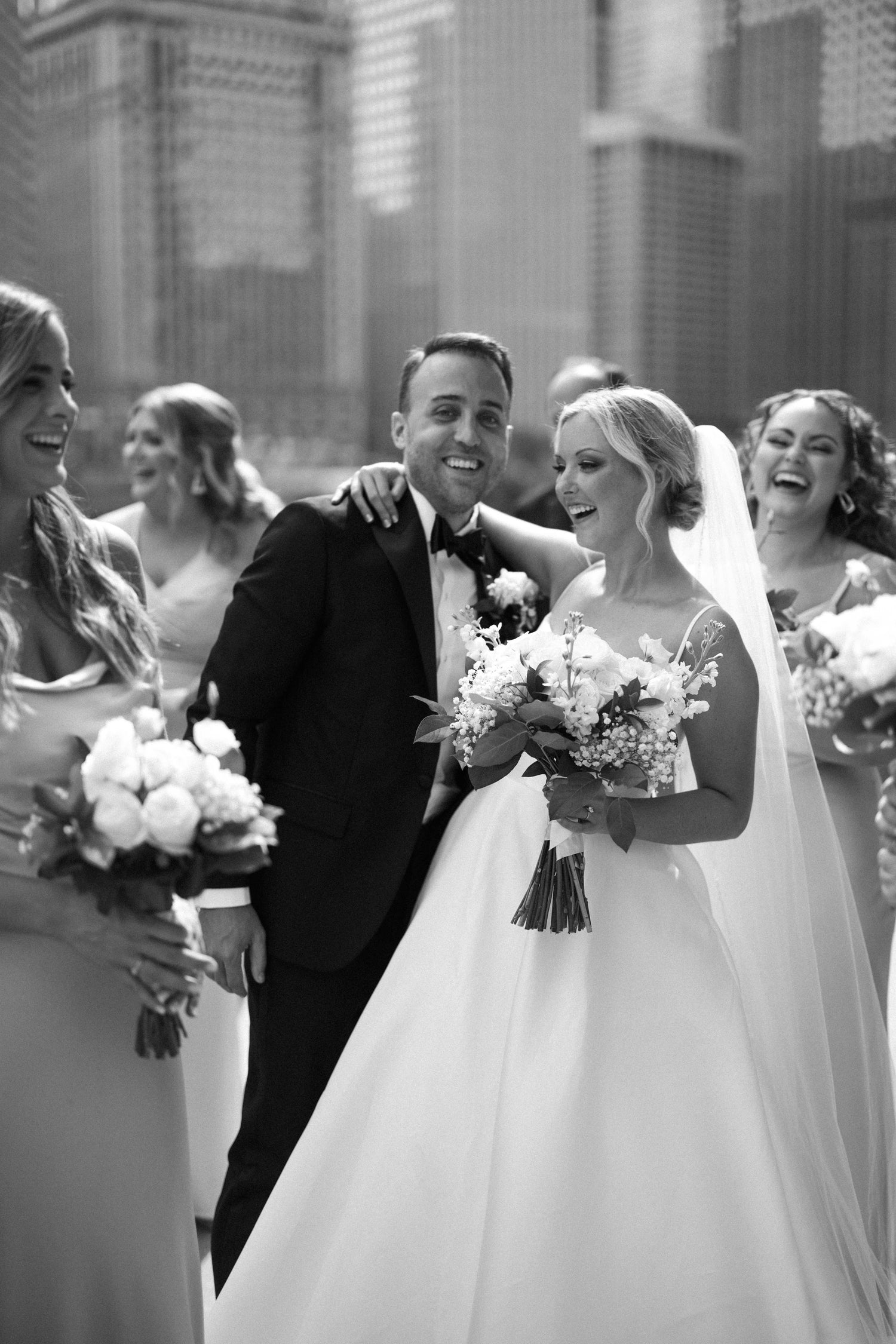 Wedding party with bride and groom in an urban setting